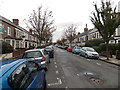 Two long lines of cars parked in Richards Street, Cathays, Cardiff