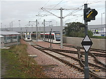 NT1573 : Tram crossing and signal by M J Richardson
