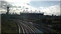 View of the Olympic Stadium, Canary Wharf, Arcelo-Mittal Orbit Sculpture and railway lines from Waterden Road