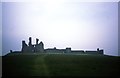 NU2521 : Dunstanburgh Castle by Jeff Buck
