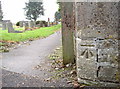 Benchmark by Christ Church graveyard