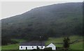 Traditional long cottage below the slopes of Slieve Gullion