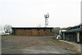 Straw bales and phone mast at Bunny Hill Riding Centre