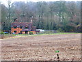 House on the A339 seen from the old railway line