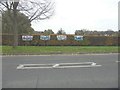 Banners on a hedge beside Kingsmead Road