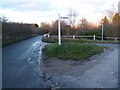 Grass covered road junction near Little Henham