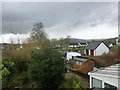 View across back gardens towards playing fields and Ugborough Beacon, South Brent