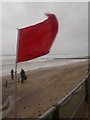 SZ1191 : Boscombe: fiercely flying flag by the beach by Chris Downer
