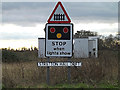 TM2539 : Level Crossing & Stratton Hall Drift signs by Geographer
