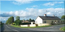 N8384 : Cottages at the junction of the R162 and the L34012 at Arrigal  by Eric Jones