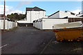 Bath in a skip near lockup garages in Rogerstone, Newport