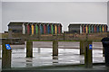 NZ3279 : Sorry looking beach huts - not their type of weather by Ian Greig