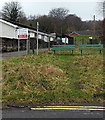 Green benches alongside  the Pontypridd Circular Walk, Treforest