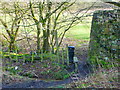 Stile and signpost on permissive footpath