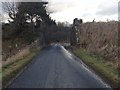 Dismantled railway bridge over a road near Haddo