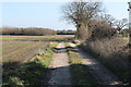 TG0431 : Track and Footpath towards a dismantled railway by J.Hannan-Briggs