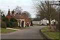 Houses and post box on the corner of White Pit Way and Pinfold Lane