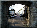 Road through an archway in Caernarfon Castle wall 