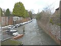 Floodwater flowing along The Causeway