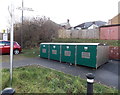 Recycling bins at the edge of a town centre car park in Blackwood