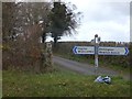 Signpost and stone cross at Hook Cross