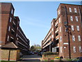 Looking through the gap between two blocks to Seven Sisters Road