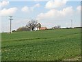 TL2181 : Across fields to Wood Walton Church by John Sutton