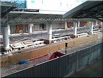 SJ8185 : New Metrolink construction under way at Manchester Airport railway station by David Martin