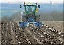 SE9916 : Ploughing Potato Beds near Saxby All Saints by David Wright