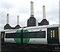 TQ2877 : Train passing Battersea power station by Thomas Nugent