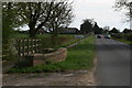 Road into Linwood and stone bridge over a unnamed drain