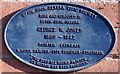 Oval plaque on an Upton-upon-Severn school wall