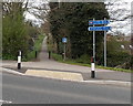 Precisely equidistant signpost alongside Maendy Way, Cwmbran