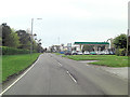 B4436 passes a filling station in Merton