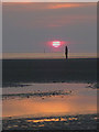 SJ3098 : Staring at the sun, 'Another Place', Crosby Beach by Karl and Ali