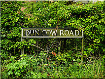 TM4693 : Dun Cow Road sign by Geographer