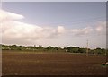 Wires over ploughed field