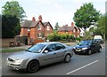 Aspley Hall Cottages and a stream of traffic