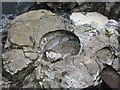 NN2432 : Rock pestle and mortar at Eas Urchaidh by M J Richardson