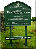 TL8646 : Holy Trinity Church sign by Geographer