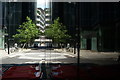 View of a reflection of buildings on Ropemaker Street in another building on Ropemaker Street