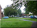 Looking from Sandford Avenue towards a bus in Gomer Lane