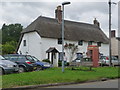 Wool: phone box and thatched cottage, High Street