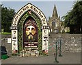 Floral memorial by the church in Hope