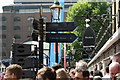 View of a fingerpost and shop signs in St. Katharine