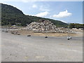SH7767 : Rubble at Surf Snowdonia site by Richard Hoare