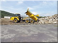 SH7767 : Tipping of rubble at Surf Snowdonia by Richard Hoare
