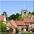 Leaning tower and tiled roofs