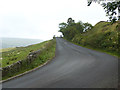 NY6850 : Steep hill and bend on the A689 by Oliver Dixon