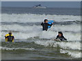 C7536 : Surfers enjoying the waves, Downhill by Kenneth  Allen